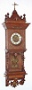 German, Lenzkirch, oak cased wall clock, the lower case with full turned columns and open-well construction showing the pendulum in full view, and the case with profuse bronze trimmings, c.1880, serial 723874