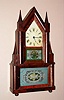 Elisha Manross, Bristol, Conn, double steeple 8 day time and strike spring driven double fusee mvt in mahogany veneered case on ball feet with reverse painted tablets, c1845. Note heavy strap brass movement with heavy cast iron bracket for spring barrels.
