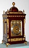English, mahogany cased Victorian, triple fusee chiming bracket clock, playing your choice of Whittington tune on 8 bells or Westminster on 4 heavy flat-wire gongs, and then counting the hours on a large deep-toned cathedral gong. The impressive case with ormolu caryatids to the corners surmounted by a large pineapple finial, surrounded by 4 flame finials. The finely engraved dial plate is gilded and with subsidiary dials for chime-silent, F/S and tune selection.