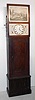 German tall case "organ or flute clock", 3-piece dial with painted scene of naval battle above round metal dial, time and strike weight driven movement in grain painted case with faux-grain burled door, 8-tune c1850