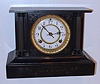 Waterbury Clock Co, Conn. iron 8-day time and strike mantel clock in black enameled case, c1906