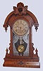 Wm. L. Gilbert Clock Co., Winsted, Conn., "Parisian Improved" walnut 8-day time and strike parlor clock, C.1880.