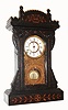F. Kroeber Clock Co., New York, "Saratoga" ebony 8-day time and strike mantel clock, C.1881.