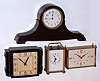 Clocks- (4) table clocks: a New Haven miniature tambour clock, an Ingraham "Miller" 8 day, a Seth Thomas gilt 8 day desk clock with German movement and a Le Gant quartz carriage clock