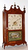 Seth Thomas, Plymouth, Conn., pillar and scroll mantel clock 30 hour time and strike wooden works movement in mahogany veneer case with reverse painted tablet, c1820