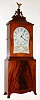 Elmer O. Stennes, Weymouth, Mass., reproduction Massachusetts shelf clock with 8 day time only one weight driven movement in crotch mahogany veneer case with banded inlay across top and base and painted kidney dial, c1971