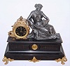 French figural of Urania, the goddess of astronomy, mantel clock with 8 day time and strike on bell, pendulum movement in spelter casting on slate base, c1890