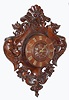 French or Swiss carved wall clock 8 day time and gong strike spring driven French movement in a large finely carved case with floral and fruit motif flanked by two winged dragon creatures, c1880