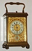 French, gilt brass case carriage clock, time, gong strike, alarm with repeat in a Corniche case with a gilt floral-trellis mask surrounding the dial (nicely pierced and chased), C. 1900