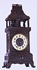 French, Marti and Cie, 8-day time/strike automaton of two figures striking a bell in the tower. The heavy case appears to be white metal with a dark finish applied. The bell ringers do not actually strike the bell as the movement strikes a wire gong to indicate the hours (it is a deep tone gong that sounds similar to a large bell), C. 1900