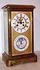 French, 8-day time/strike brass and glass double dial crystal regulator calendar clock retailed by Fr. Baumann, Wien., the calendar dial is perpetual, correcting for short months, and with phases of the moon. Dials are offset by a stippled and gilt brass mask, C.1900