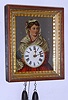 German, Black Forest, 30-hour wood and brass weight movement time/strike blinking eye picture frame wall clock; note pendulum is taped to back of case and not showing in photograph, C. 1850