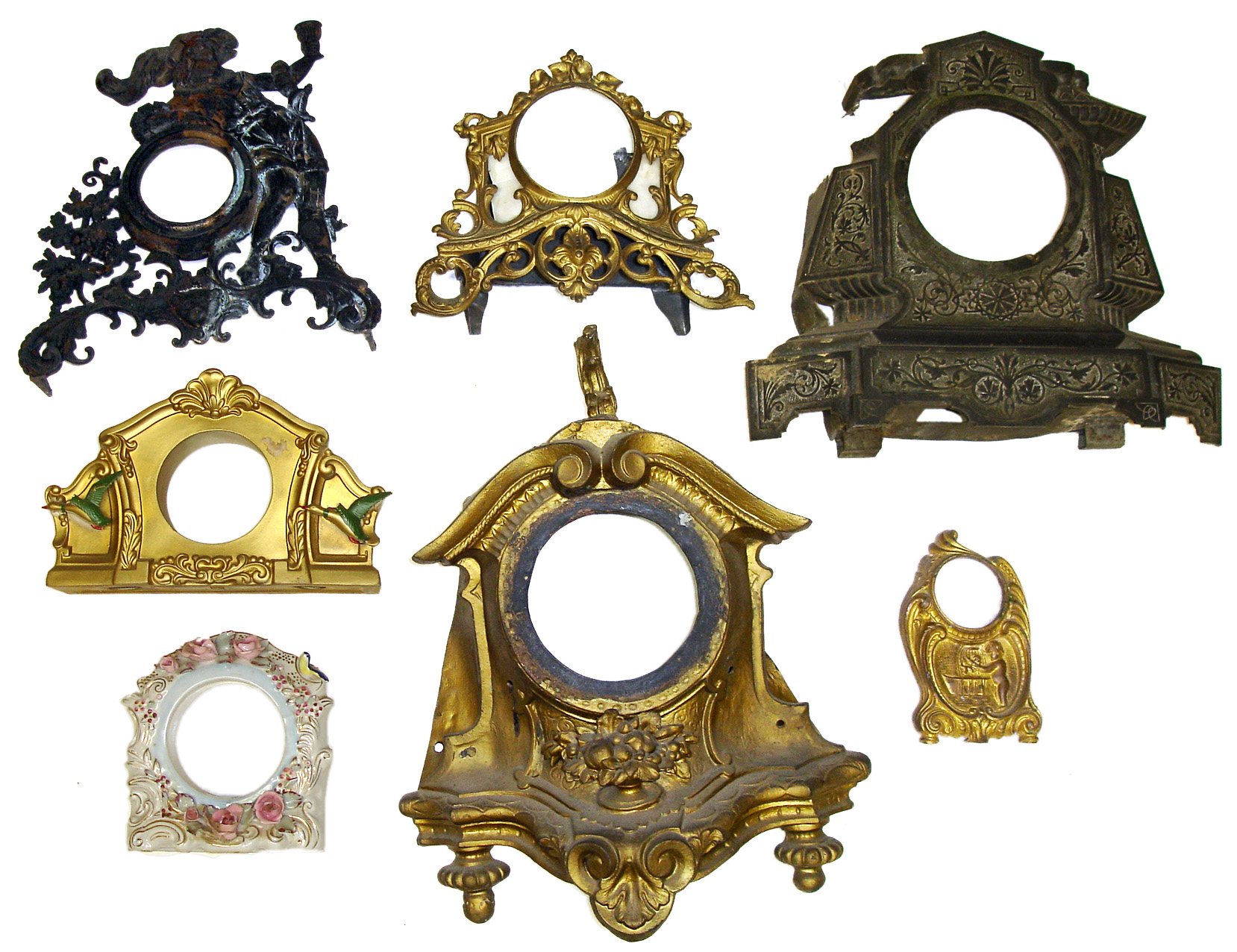 Seven decorative clock cases. Includes one nice small China, large gold, drinking cavalier, etc. — Antique Clocks Price Guide