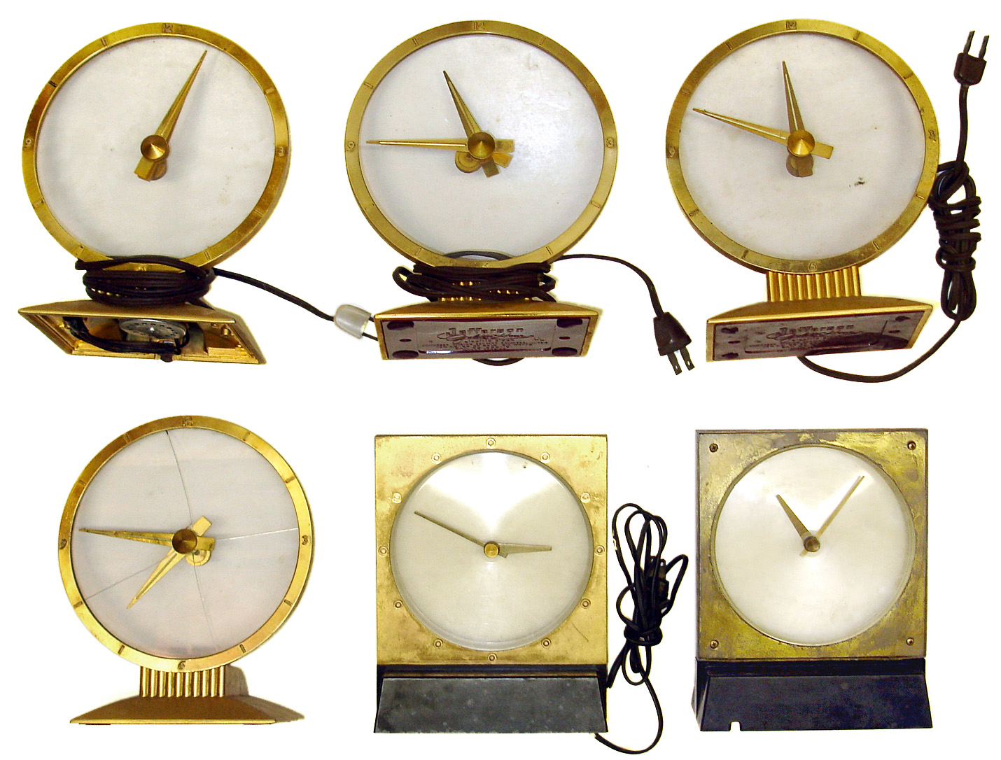 Six electric mystery clocks. 4 Jefferson Golden Hour clocks (one glass broken, one missing its red bottom cover), 2 square style (one missing its base and motor). — Antique Clocks Price Guide