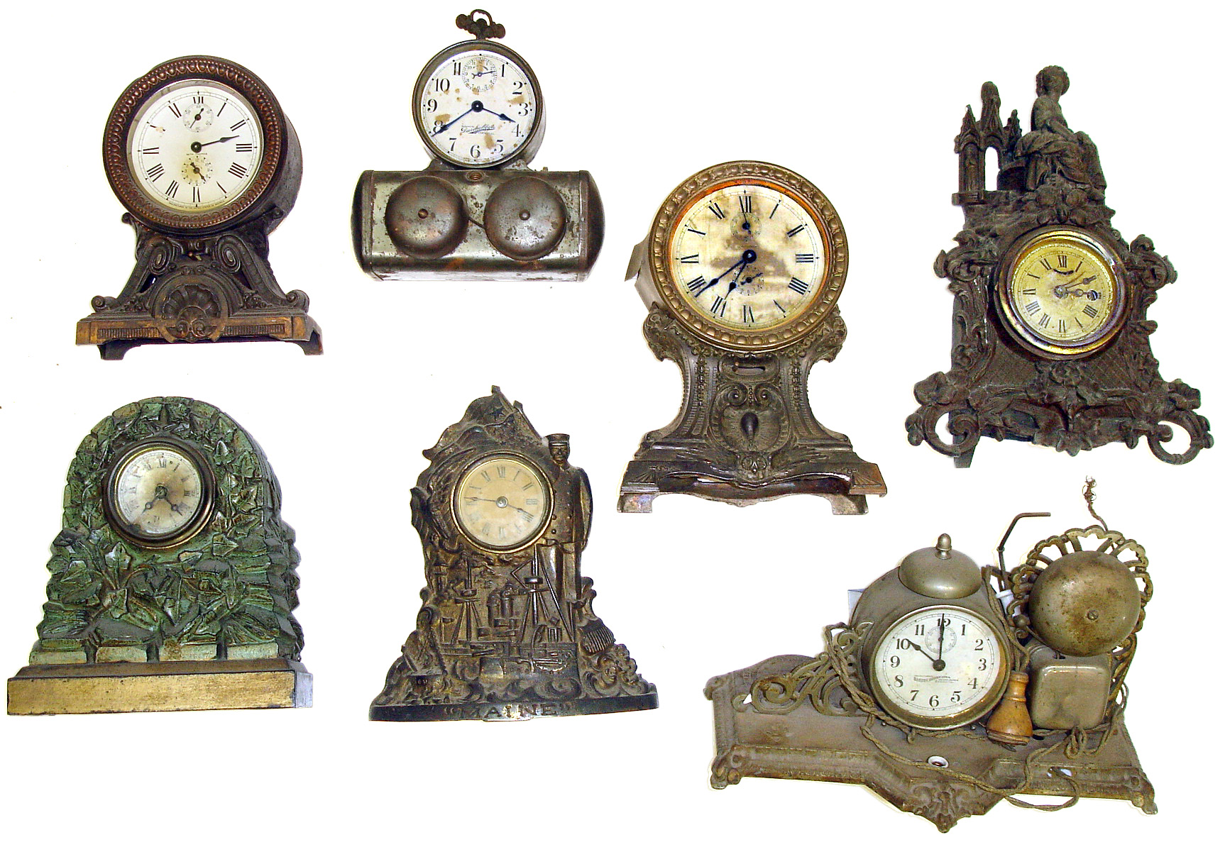 Seven metal-case clocks. Includes 2 Darche (battery alarm), 2 Seth Thomas long alarms, a "Maine" marine novelty, green rocks novelty, and cast iron figural. — Antique Clocks Price Guide