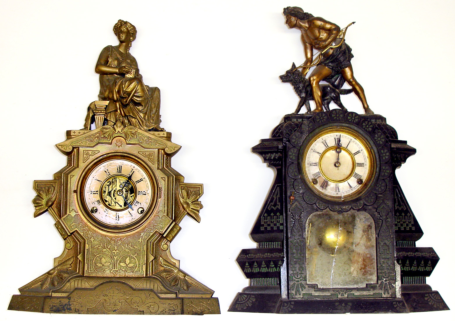 Two large cast metal figural clocks. One is a Kroeber with barrel pendulum and well done man and dog atop. A classical lady seated with her jewelry box adorns the other. — Antique Clocks Price Guide