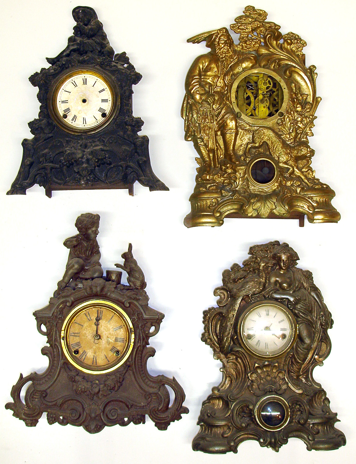 Four Connecticut 8-day figural iron fronts Detailed castings, one with drum playing rabbit. One by Ansonia Brass and Copper. Largest, by Welch and missing its dial, is 19" high. — Antique Clocks Price Guide