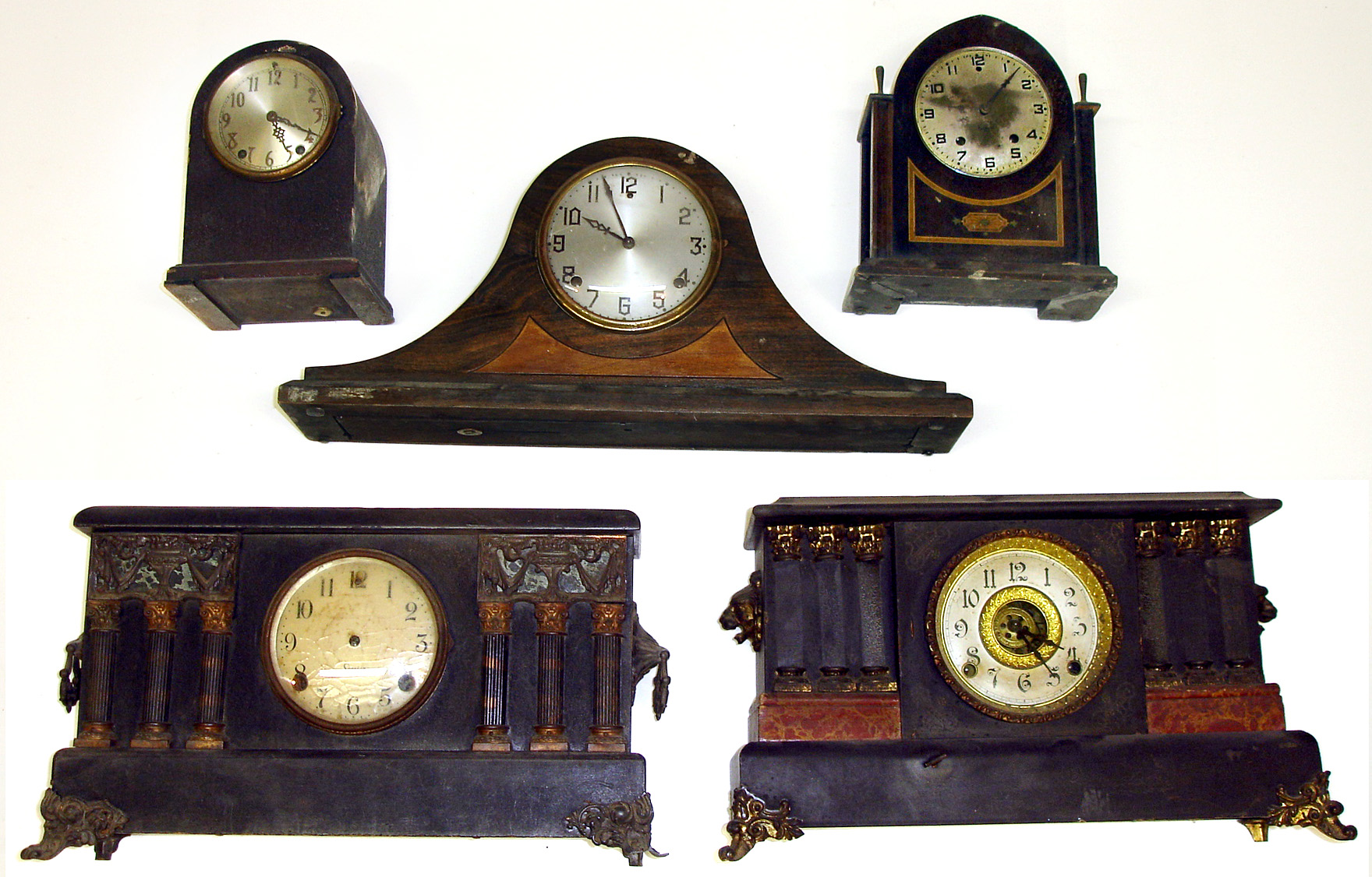 Five wood case Connecticut 8-day mantel clocks. Sessions 6 column, Gilbert tambour and lancet, Ingraham black with unusual front wind separate alarm movement, and Seth Thomas round top with 48J round plated spring movement — Antique Clocks Price Guide