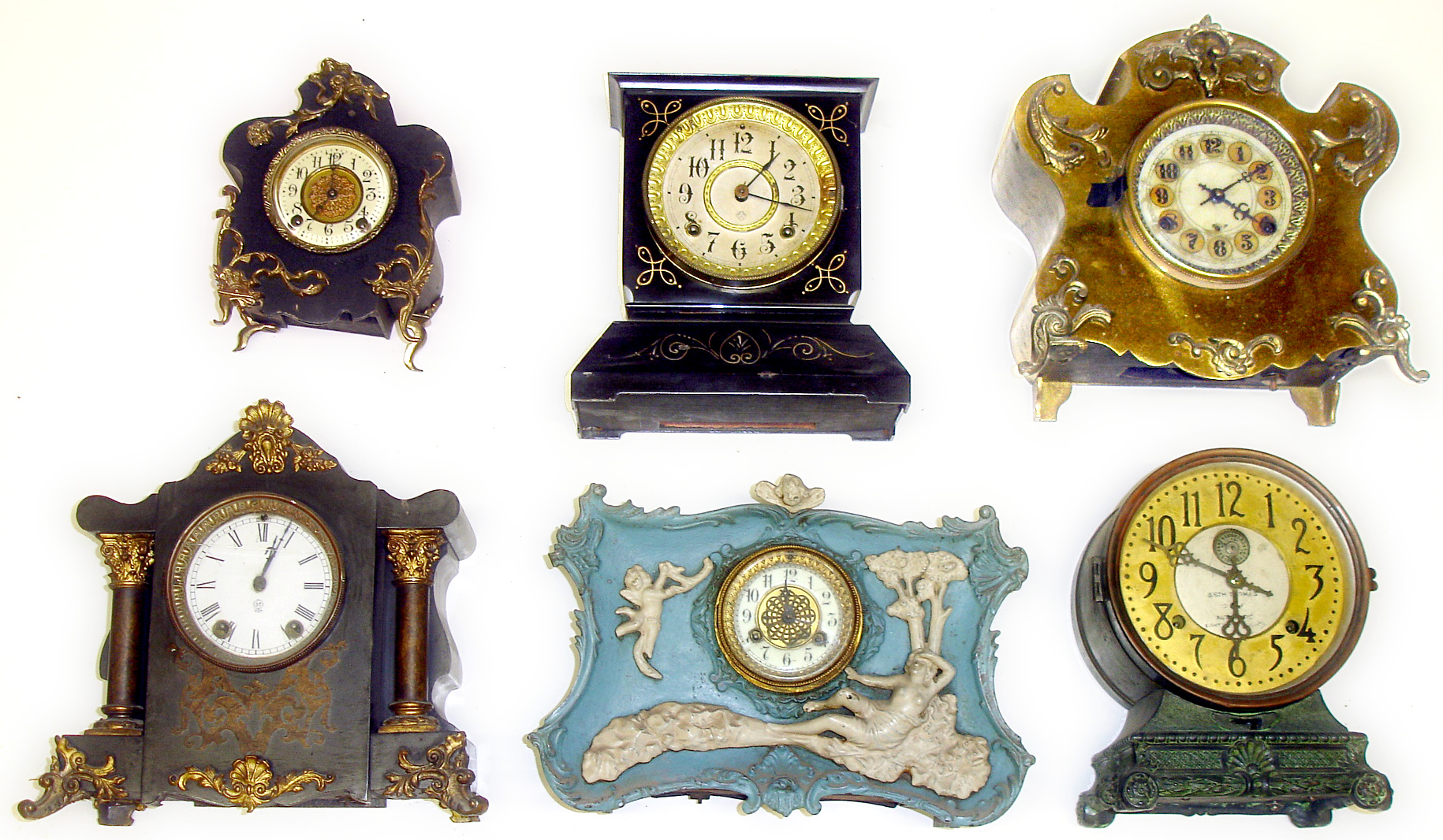 Six metal case 8-day Connecticut mantel clocks. Includes Seth Thomas alarm, Waterbury blue front with white applied figures, and Ansonia. Largest is 11" high. — Antique Clocks Price Guide