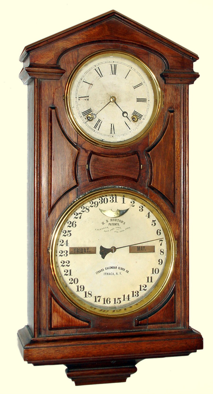 Ithaca Calendar Clock Co., Ithaca, NY, "Hanging Cottage No. 7" double dial calendar wall clock with 30 day time only double spring driven movement in walnut case, c1875 — Antique Clocks Price Guide