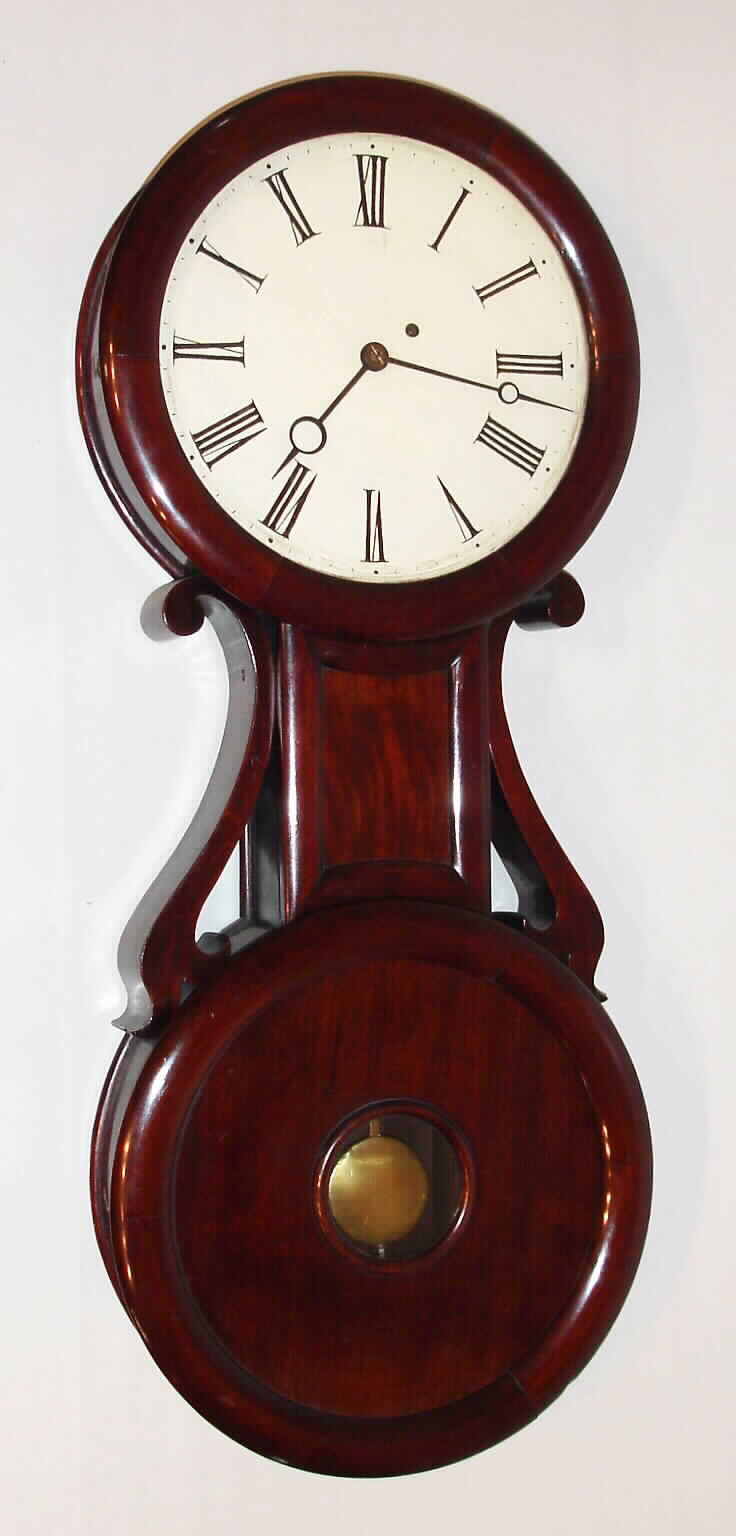 "Baltimore Banjo" attributed to George D. Hatch wall clock 8 day time only weight driven movement in highly stylized mahogany case with bold mahogany side arms pendulum aperture and painted metal dial, c1860 — Antique Clocks Price Guide