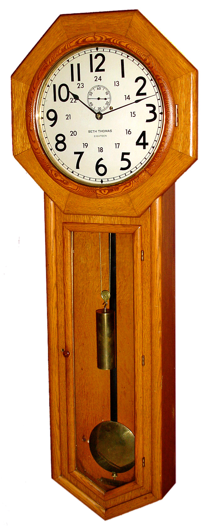 Seth Thomas Clock Co., Thomaston, Conn., "Regulator No. 18" wall clock 8 day time only weight driven movement in oak case with painted metal dial, brass weight and brass bob, c1910 — Antique Clocks Price Guide