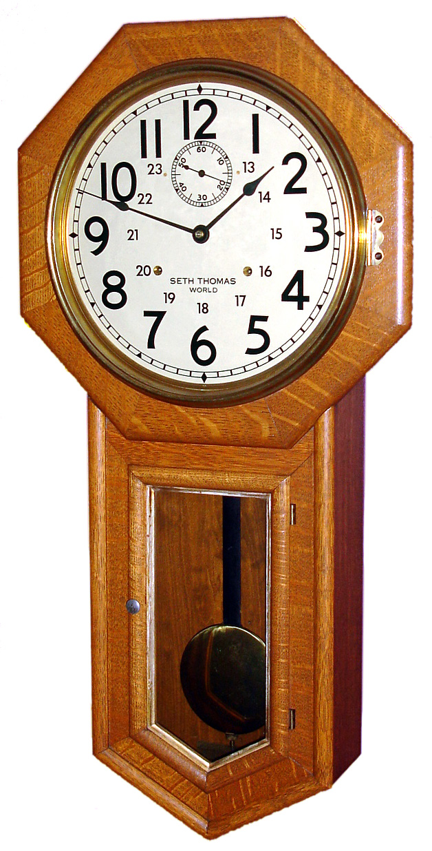 Seth Thomas Clock Co., Thomaston, Conn., "World" wall clock 15 day, double spring, time only movement stamped "86W" in oak case with gold leaf molding around door glass and painted metal dial, c1913 — Antique Clocks Price Guide