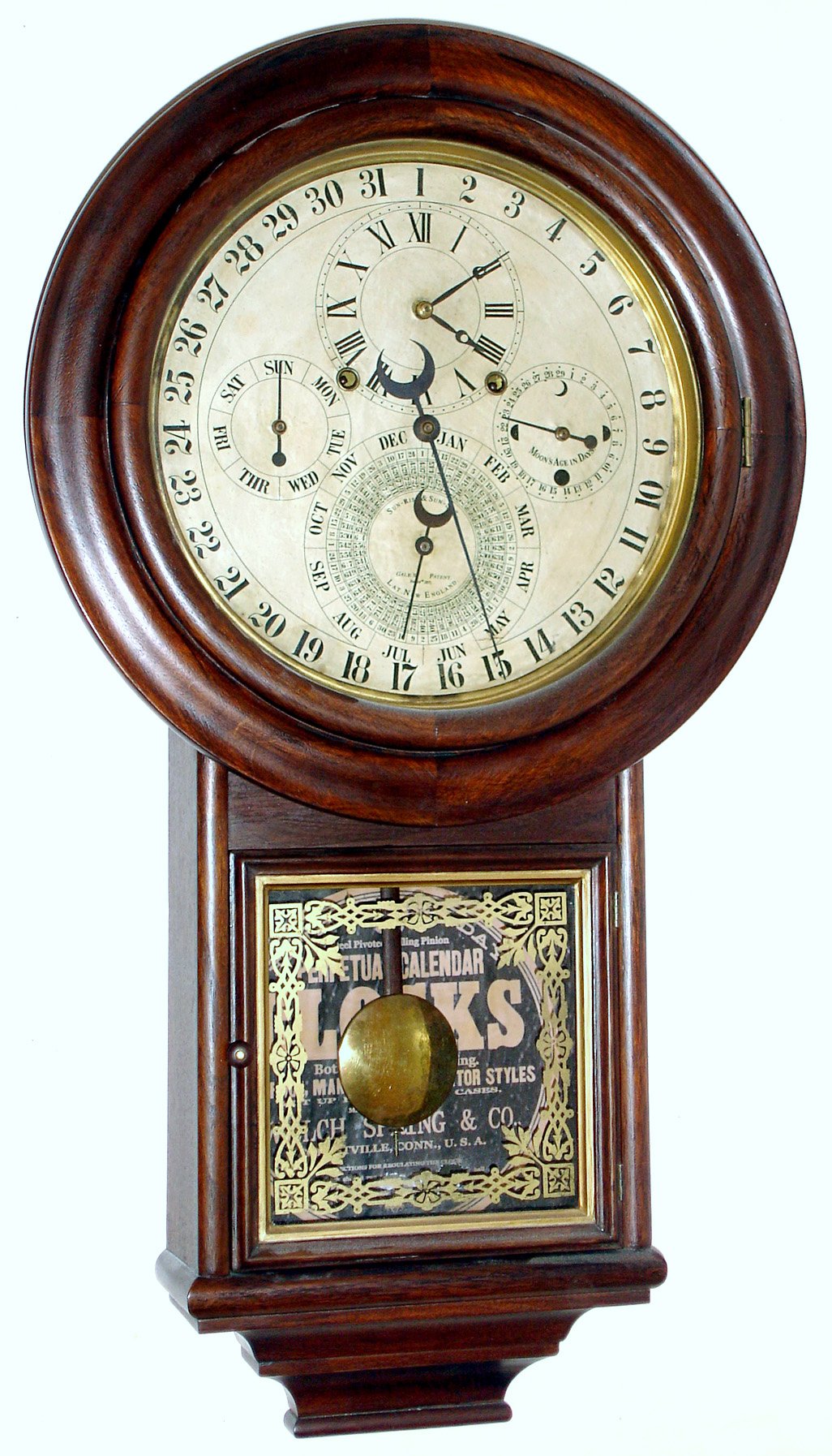 D. J. Gale, "Drop Calendar No. 3", perpetual calendar wall clock with 8 day spring driven movement with full astronomical indications for the age of the moon, day of week, date, month and equation of time chart showing sunrise and sunset times for New England latitudes. The case is of recent manufacture, nicely done with walnut and mahogany veneers over pine, stained a mellow walnut color. — Antique Clocks Price Guide