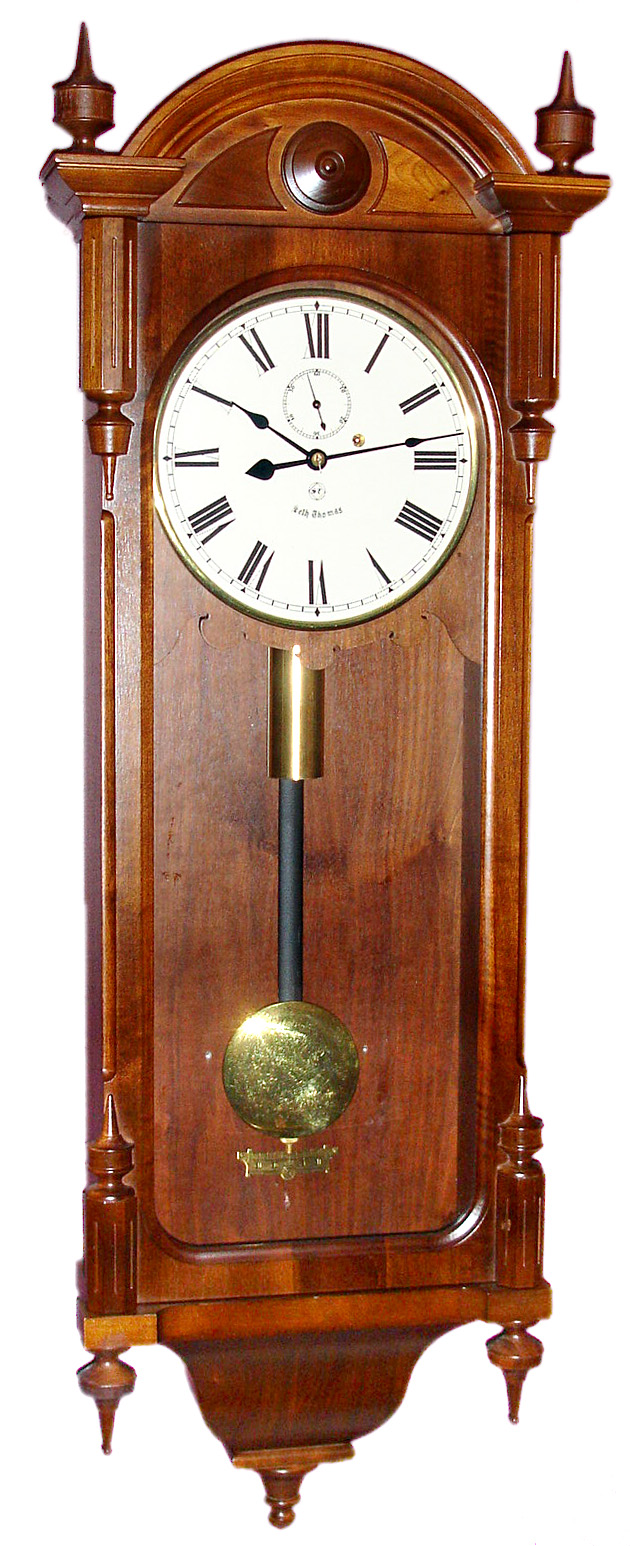 Seth Thomas Clock Co., Thomaston, Conn., "Regulator No. 6 Reissue" 8 day time only weight driven movement in walnut case with painted metal dial, c1975 — Antique Clocks Price Guide