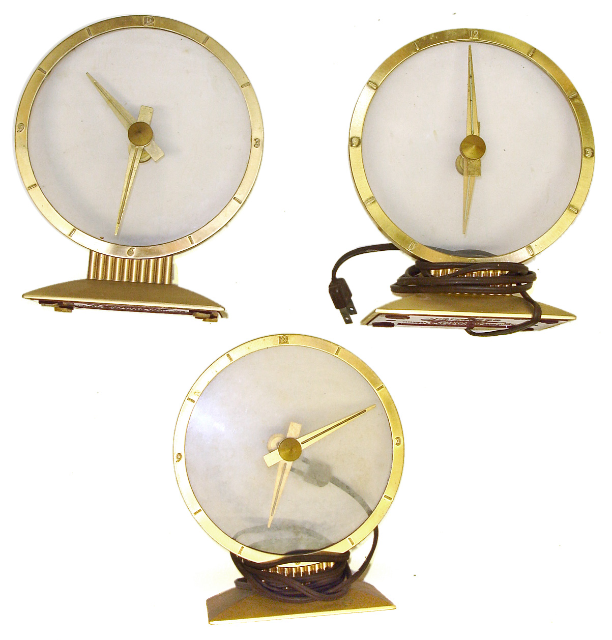Three Jefferson Golden Hour electric mystery clocks. Intact cases and glasses, one missing its red base cover. — Antique Clocks Price Guide