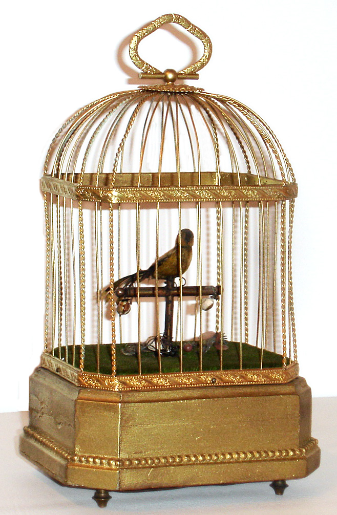 Singing Bird mechanical in cage on a wooden base, c1900 — Antique Clocks Price Guide