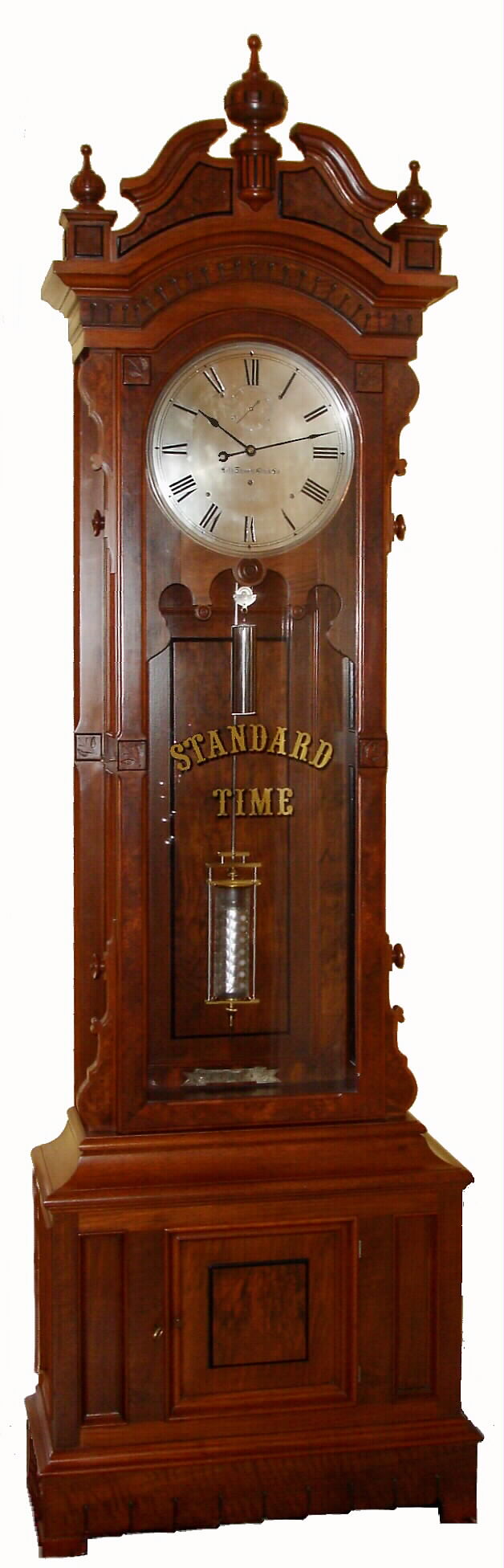 Seth Thomas Clock Co., Thomaston, Conn., "Regulator No. 15" tall case clock 8 day time only weight driven movement in walnut case with burled walnut accents, silvered metal dial and mercury thumbprint jar pendulum, c1886 — Antique Clocks Price Guide