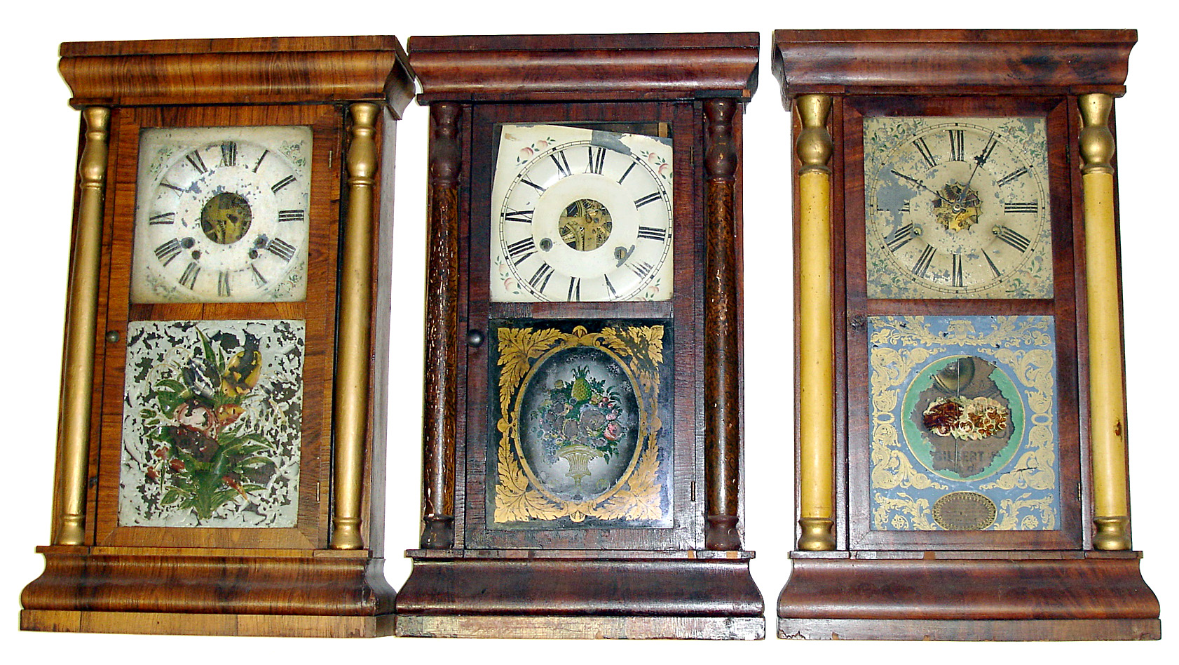 Three column and cornice 30 hour weight driven Connecticut shelf clocks, two are Seth Thomas, one with lovely early tablet showing urn overflowing with fruit and the third is a Gilbert. All 25" high with inside paper labels — Antique Clocks Price Guide