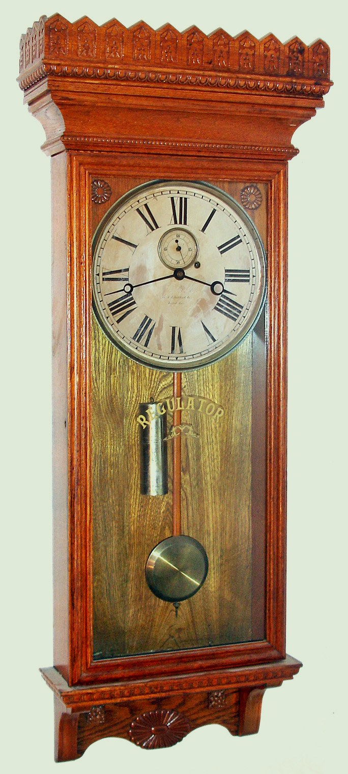 William Gilbert, Winsted, Conn. Regulator No. 14 oak 8 day weight driven wall clock, c1901. — Antique Clocks Price Guide