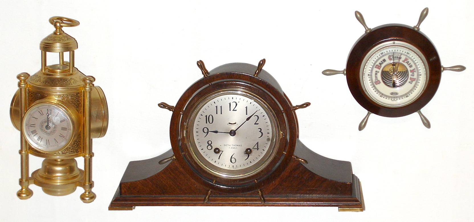 Three marine related items: Seth Thomas mahogany 7 jewel Helmsman ship's bells, 1938; modern brass weather station with quartz clock, barometer, compass, and thermometer; and German "Stellar" yacht wheel aneroid barometer. — Antique Clocks Price Guide