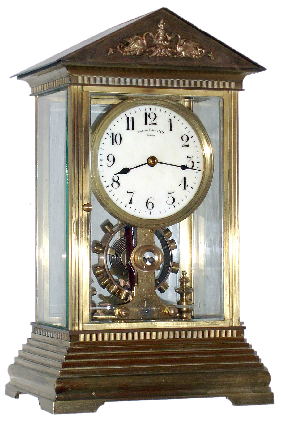 Eureka Clock Co. Ltd., London, England battery powered mantel clock in architectural crystal regulator type case with beveled glass and applied swan and urn decorations in pediment with mechanical movement electrically driven with oversized balance wheel, c1910 — Antique Clocks Price Guide