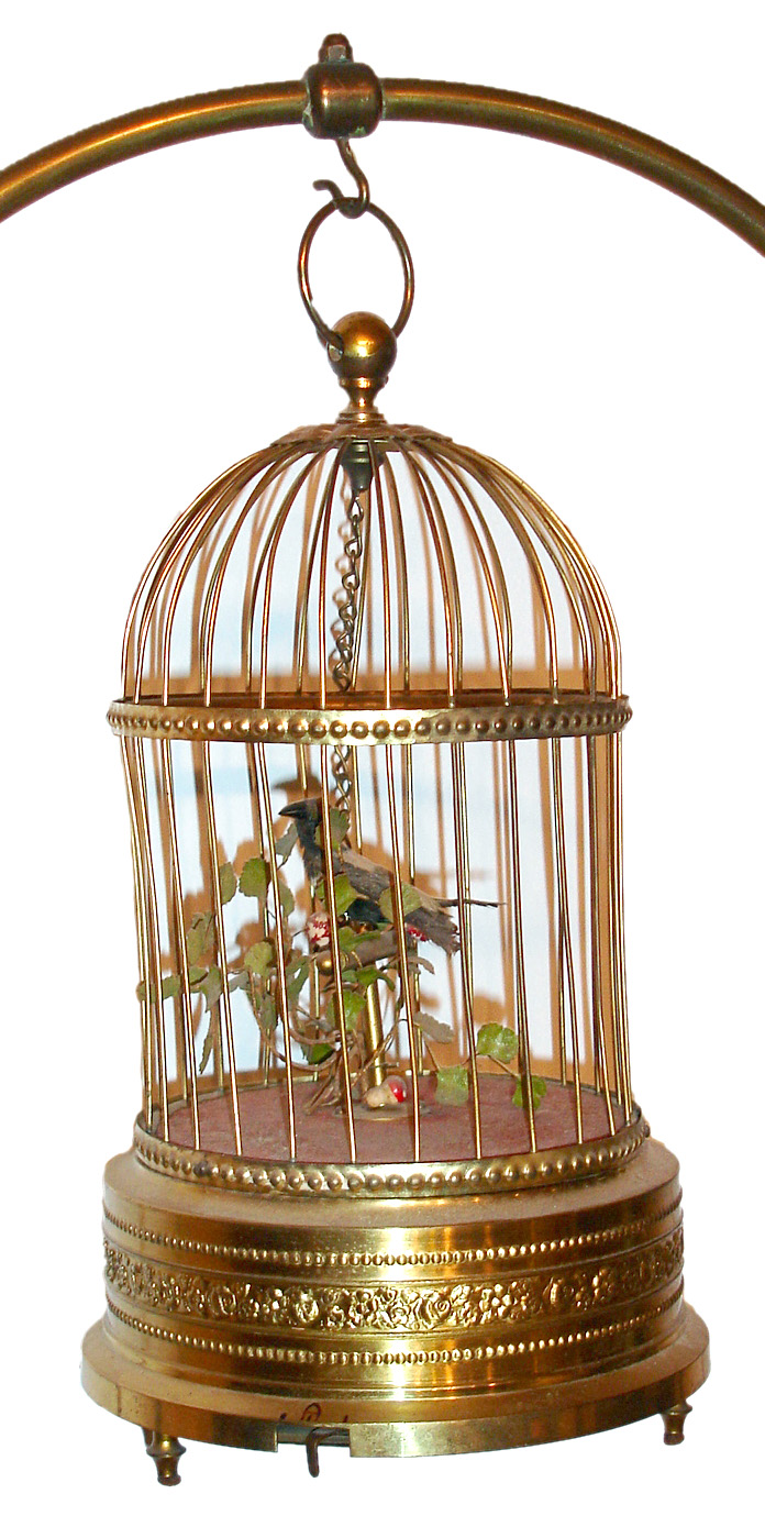 Single singing bird in cage manufactured by Karl Griesbaum, Triberg, Germany with mechanical movement imparting motion to bird on perch including brass stand for larger size bird cage, c1950 — Antique Clocks Price Guide