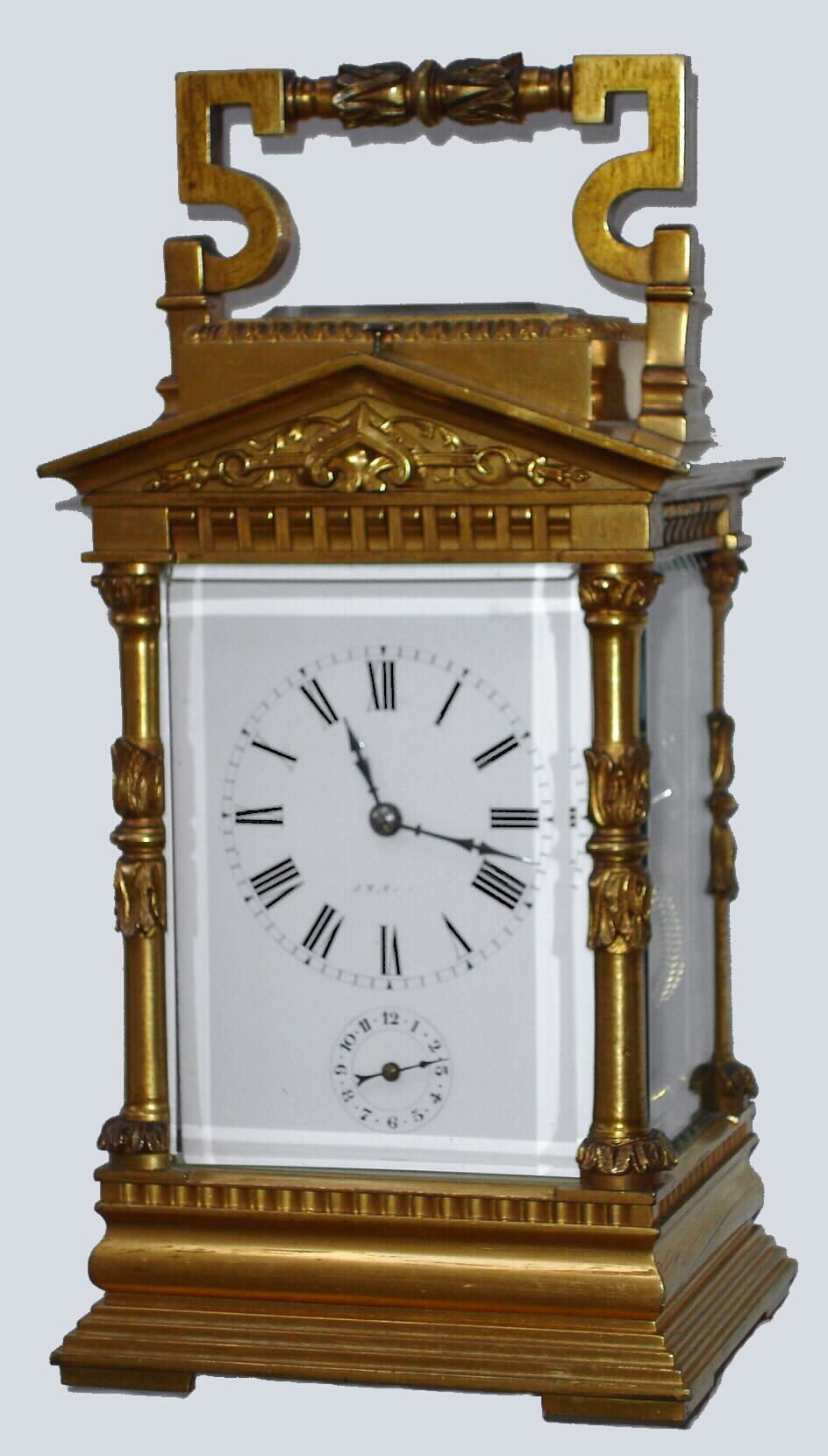 French, Brass Cased Carriage Clock, in an architectural case with Corinthian columns and a pediment top with original silvered platform visible through rectangular lens at top. This is a time, strike, repeat and alarm carriage clock, c1900 — Antique Clocks Price Guide