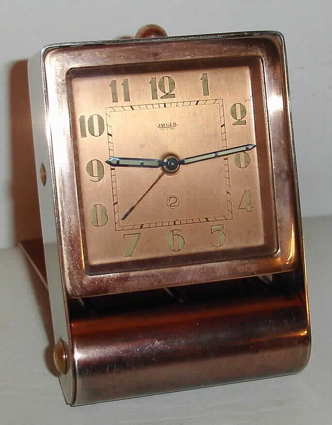 Jaeger Swiss Art Deco alarm travel clock in copper finish fold away case with Arabic numeral metal dial, c1925 — Antique Clocks Price Guide