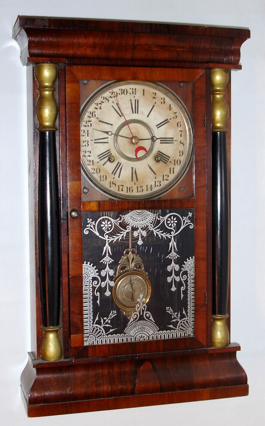 Southern Clock Co., 8 day spring driven time and strike calendar shelf clock. The movement in this clock was made by Gilbert. They could have supplied the movement or the whole clock to the Southern Clock Co, c1875 — Antique Clocks Price Guide