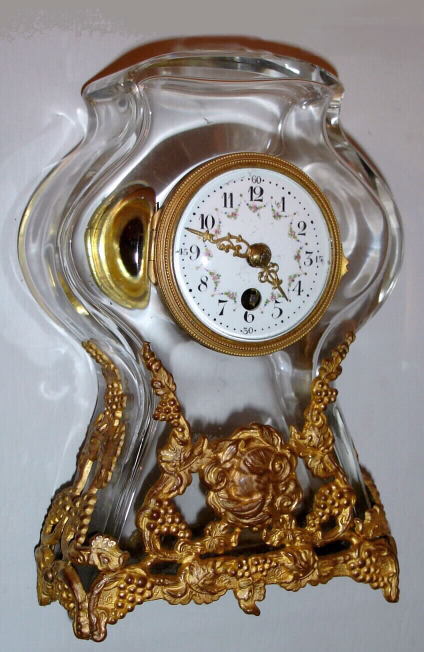 French, 8 day lever movement, glass with gilt mountings table timepiece, surmounted by the bust of a young man, c1900 — Antique Clocks Price Guide