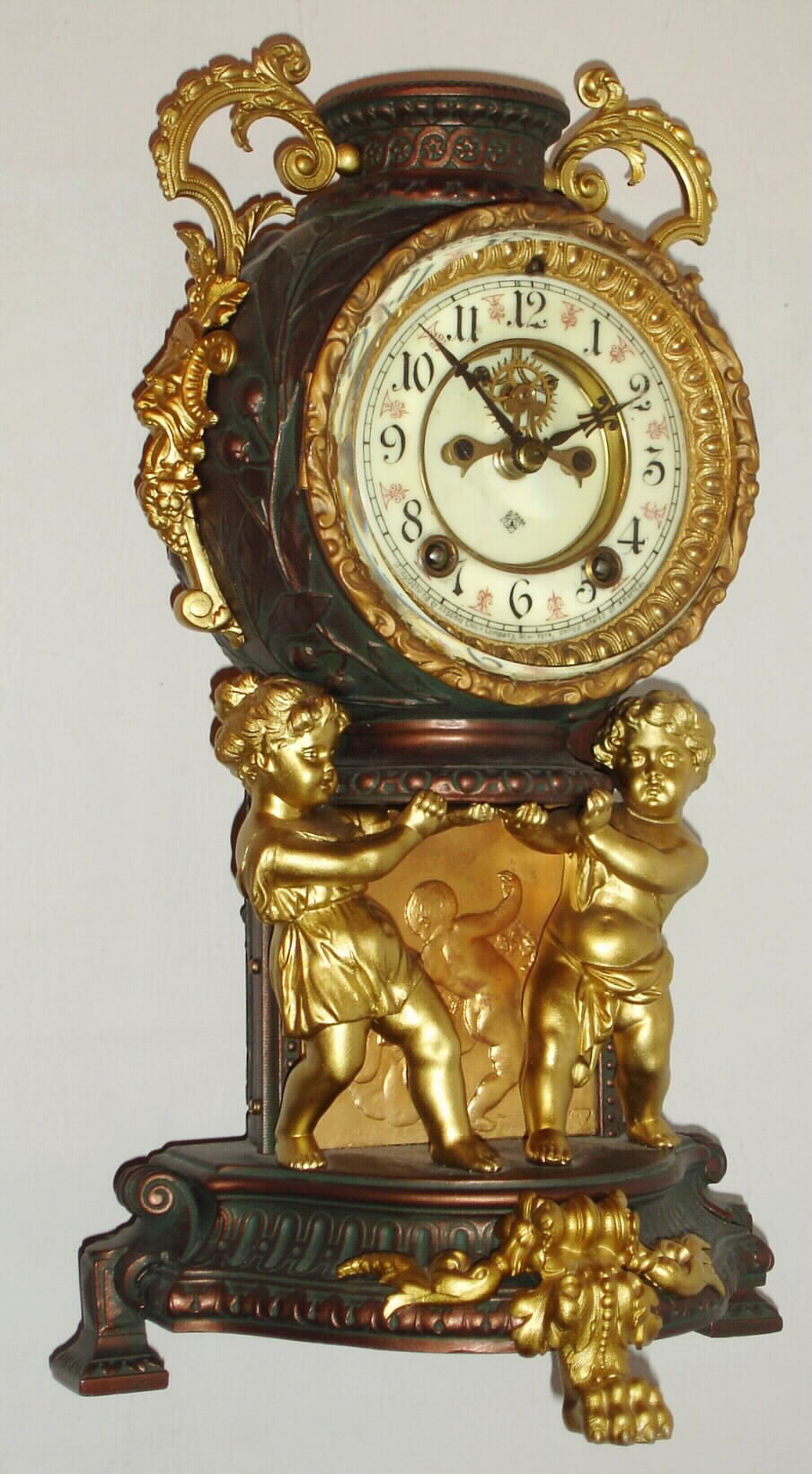 Ansonia Clock Co., "Bijou", 8 day time/strike cast metal mantel clock. c.1904 — Antique Clocks Price Guide