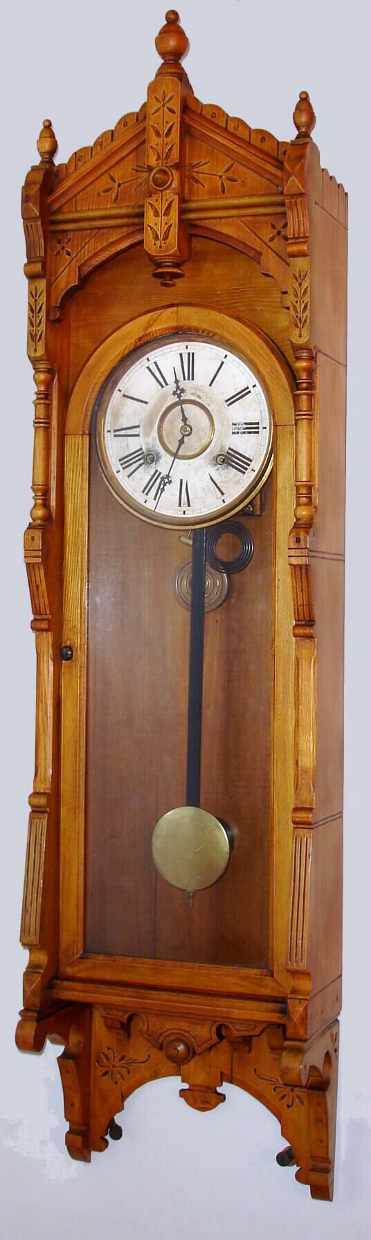 F. Kroeber Clock Co., "Regulator No. 47" wall clock 8 day time and strike spring driven movement in oak case, c1885 — Antique Clocks Price Guide