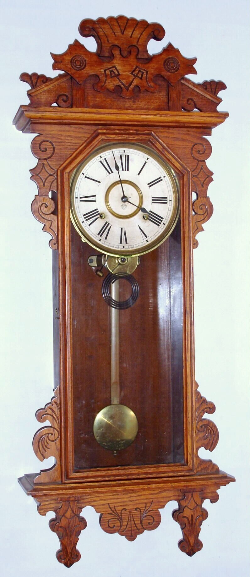Ansonia Clock Co., New York, "Bahia" oak 8 day time and strike wall clock, c1904 — Antique Clocks Price Guide