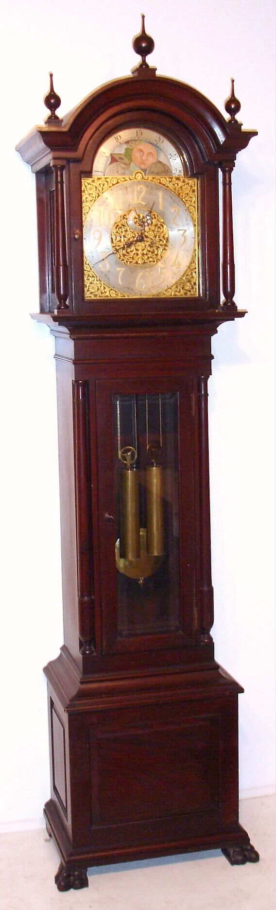 Seth Thomas, Thomaston, Conn., similar to "Hall Clock No. 34" tall clock 8 day time and strike weight driven movement in mahogany case with beveled glass lower door with brass dial and silvered chapter ring, c1900 — Antique Clocks Price Guide