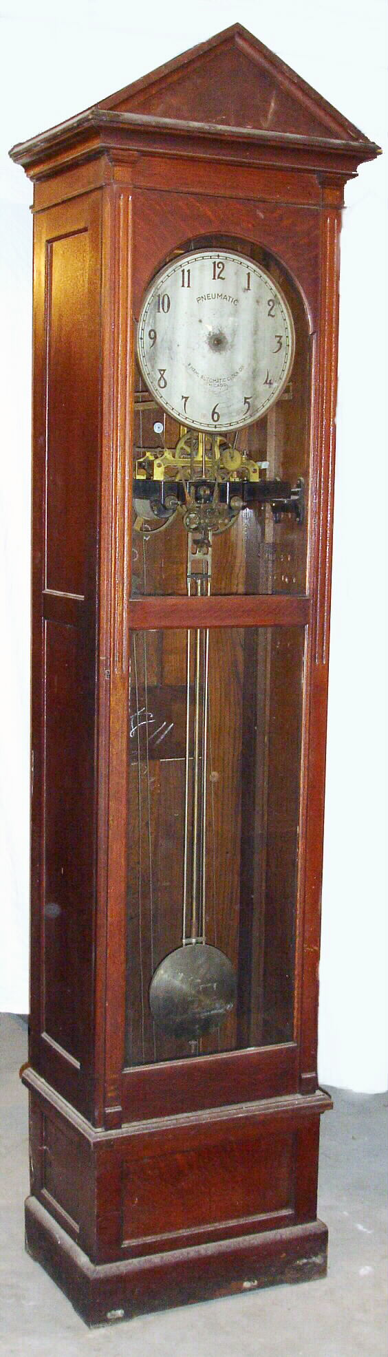 Hahl Automatic Clock Co., Chicago, Illinois, pneumatic master tall clock with 8 day or longer compound weight driven movement in paneled sides quarter sawn oak case with metal dial, c1890 — Antique Clocks Price Guide