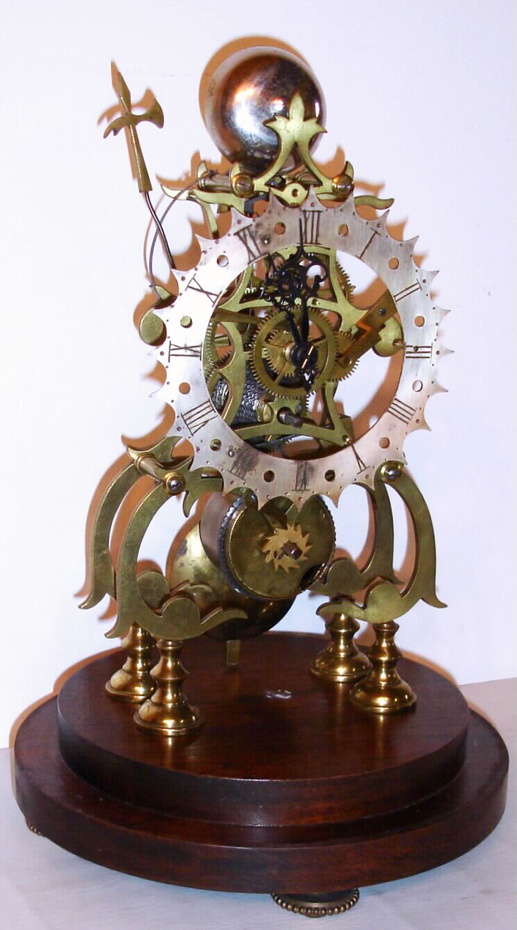 English brass skeleton clock, siingle chain fusee, 8 day time with passing strike, on base with glass cover, c1900. — Antique Clocks Price Guide