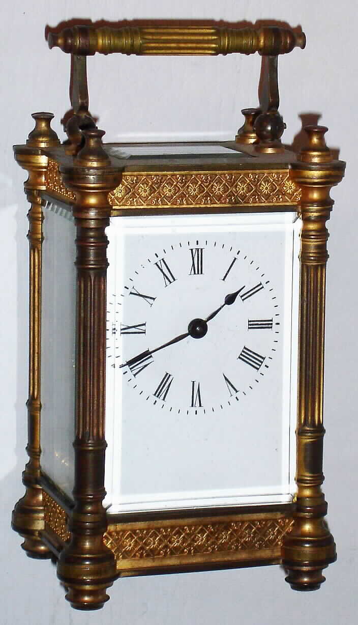 French carriage clock in footed and fluted column brass case with 8 day time only spring driven movement, c1900 — Antique Clocks Price Guide