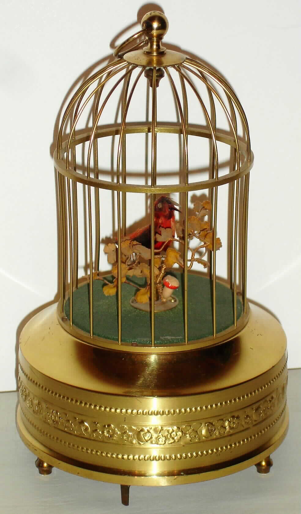 Singing bird single German mechanical with tail and beak motion when singing in gilt cage, c1930 — Antique Clocks Price Guide