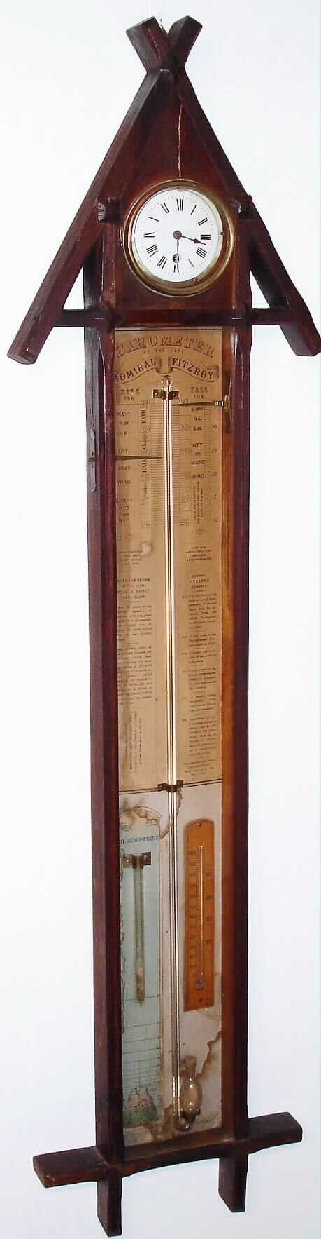 Admiral Fitzroy Barometer and time piece, English, in a walnut case with carved top and bottom. The printed paper label backing the barometer gives full details on use of the instrument, which includes a thermometer and an indicator for height of the atmosphere in miles. The spring driven time only movement has a 4" white enamel dial, c1880 — Antique Clocks Price Guide